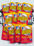 A stack of vintage 1985 MLB Baseball Puzzle & Cards trading card packs, featuring red and yellow packaging with the MLB logo and 'BASEBALL' in large letters.