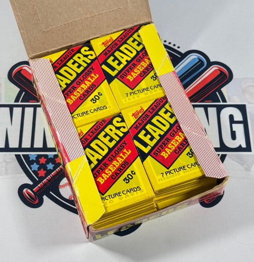 Stack of Topps Leaders trading card packs with a cardboard box on a white background.