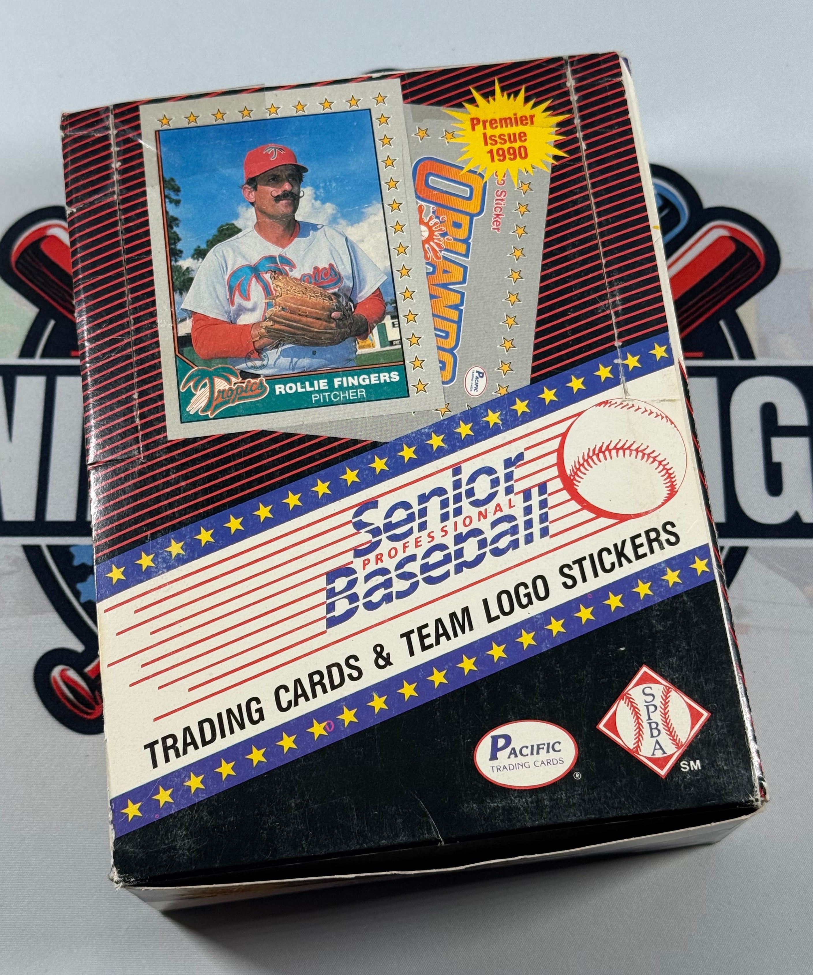 Baseball trading card box with a card featuring an Orlando player on a gray background
