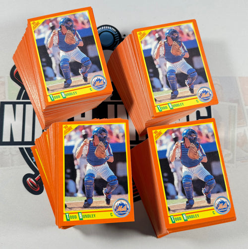 Collection of baseball trading cards featuring a player in a blue uniform.