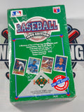 A sealed 1990 Upper Deck baseball trading card booster pack in its original green packaging, featuring team logos and player photos on the front.