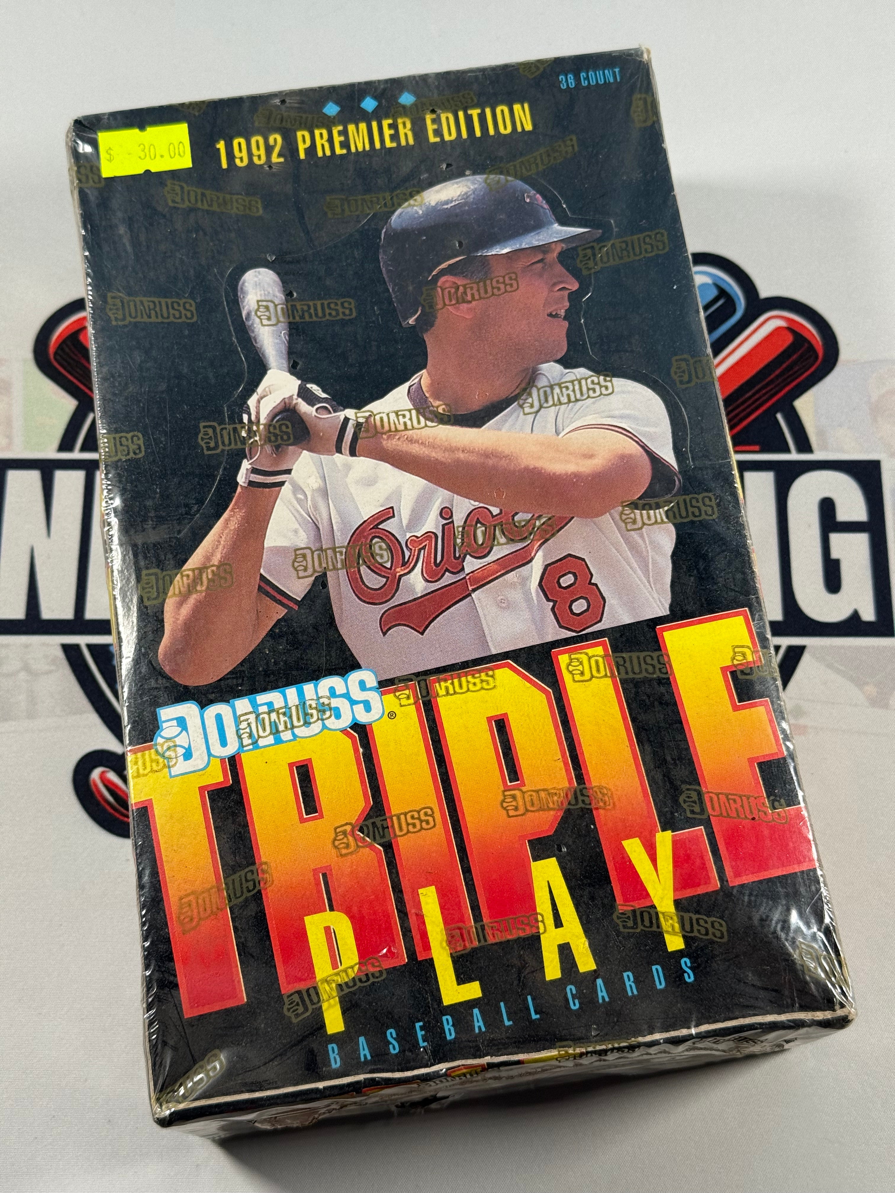 Baseball trading card pack with a player on the front, featuring the 'Triple Play' branding.