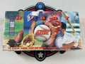 Baseball trading card box with colorful design featuring a player, bat, and ball.