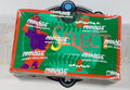 A sealed Pinnacle Select Hobby Exclusive card box with a green front, orange border, and multicolor graphics, photographed on a white surface with a black circular stand visible behind it.