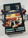 Collection of baseball trading cards in a Topps packaging on a white background
