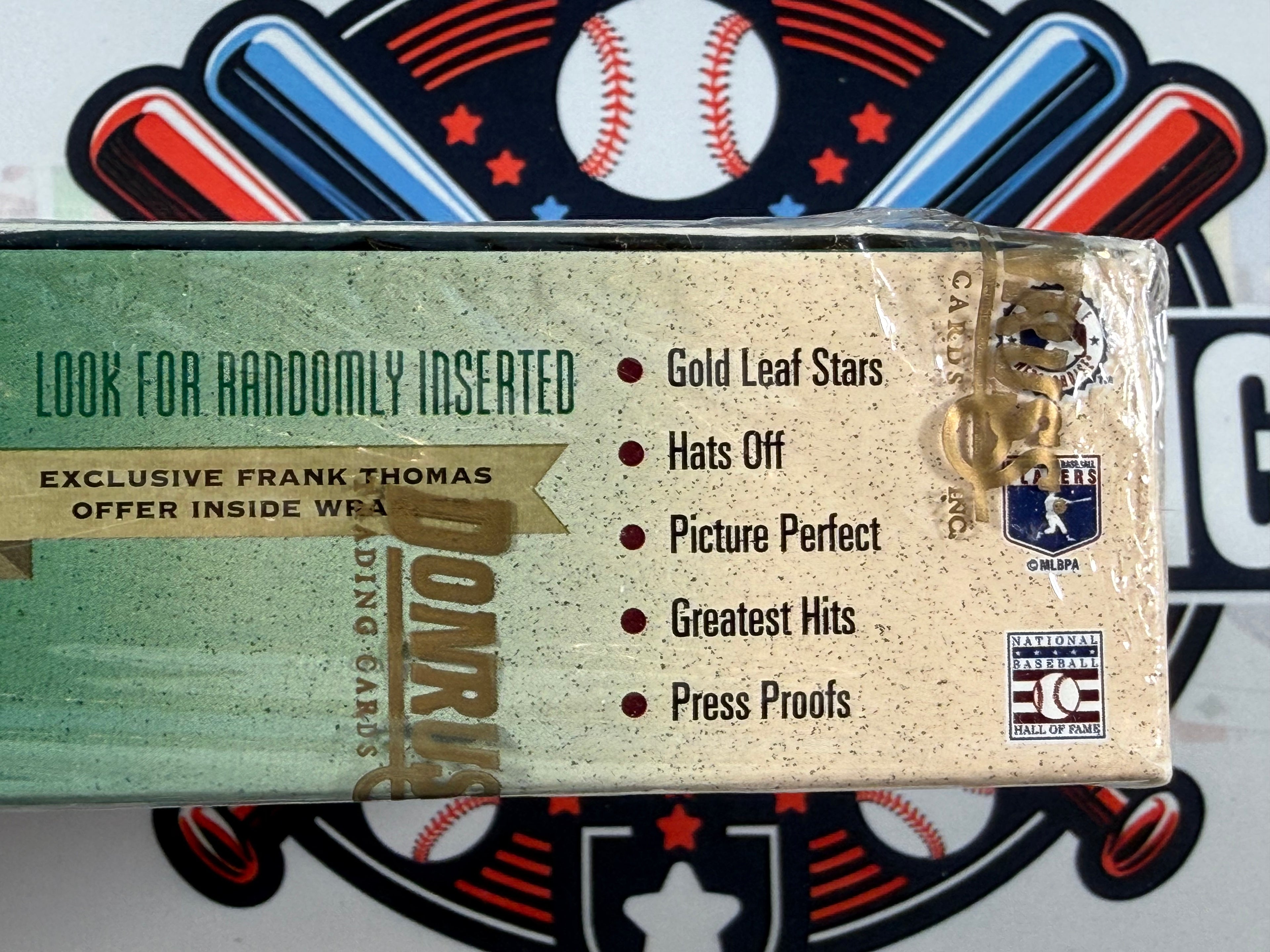 Baseball card packaging with Donruss logo and promotional text on a baseball-themed background
