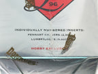 Trading card pack with individually numbered inserts and branding on a white background