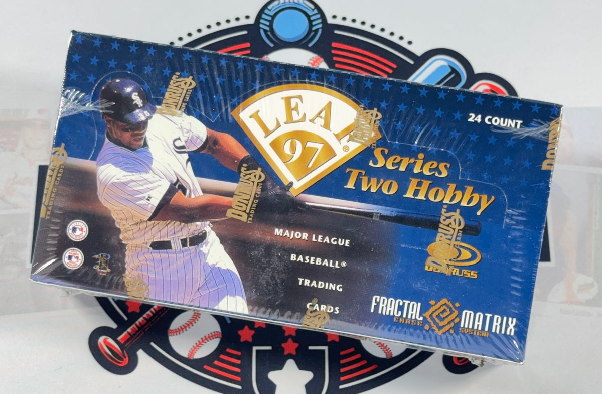 A sealed box of Leaky 97 Series Two Hobby Baseball Cards featuring a baseball player on the front, with Fractal Matrix branding, photographed against a white background with a baseball-themed graphic behind it.