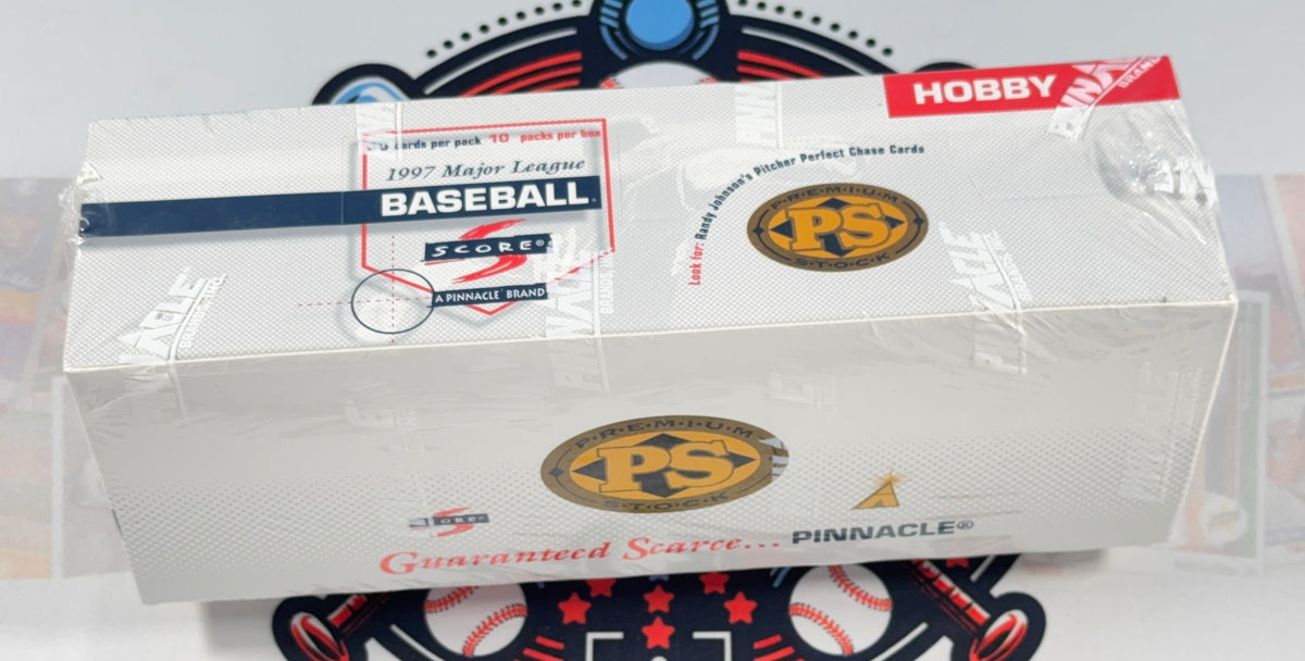A sealed white box of Pinnacle Hobby Baseball Score 1997 Matted League Baseball cards, wrapped in clear plastic, with a baseball-themed circular mat underneath.