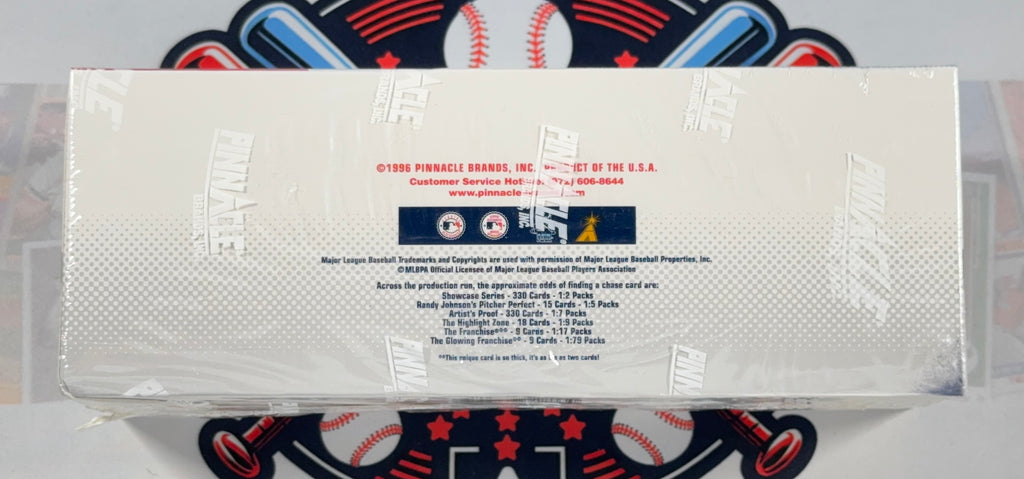 A sealed plastic-wrapped box of 2024 Topps Pinch Barrels baseball trading cards, showing the back panel with product details and team logos, placed on a baseball-themed mat.