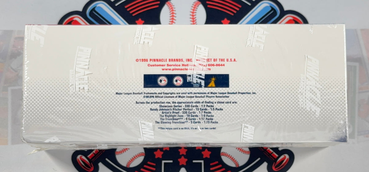 A sealed plastic-wrapped box of 2024 Topps Pinch Barrels baseball trading cards, showing the back panel with product details and team logos, placed on a baseball-themed mat.