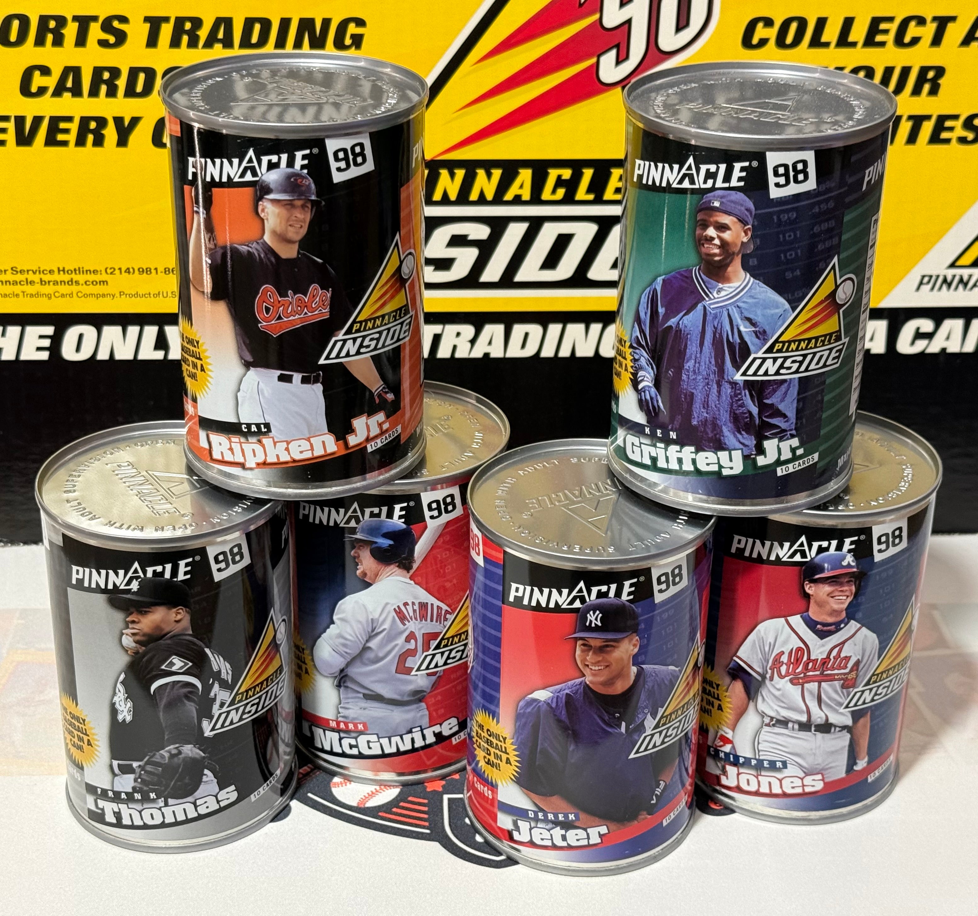 Collection of Pinnacle 98 baseball trading card cans featuring various players on a black and yellow background.