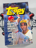 A sealed 1998 Topps Major League Baseball Series 2 trading card booster box shown at an angle. The box features the large yellow Topps logo, images of baseball players Roberto Clemente and Willie Mays, and text highlighting featured cards.