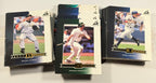 Three baseball trading cards featuring different players on a white background