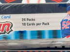 Cardboard packaging with '24 Packs 10 Cards per Pack' text and sports-themed design.