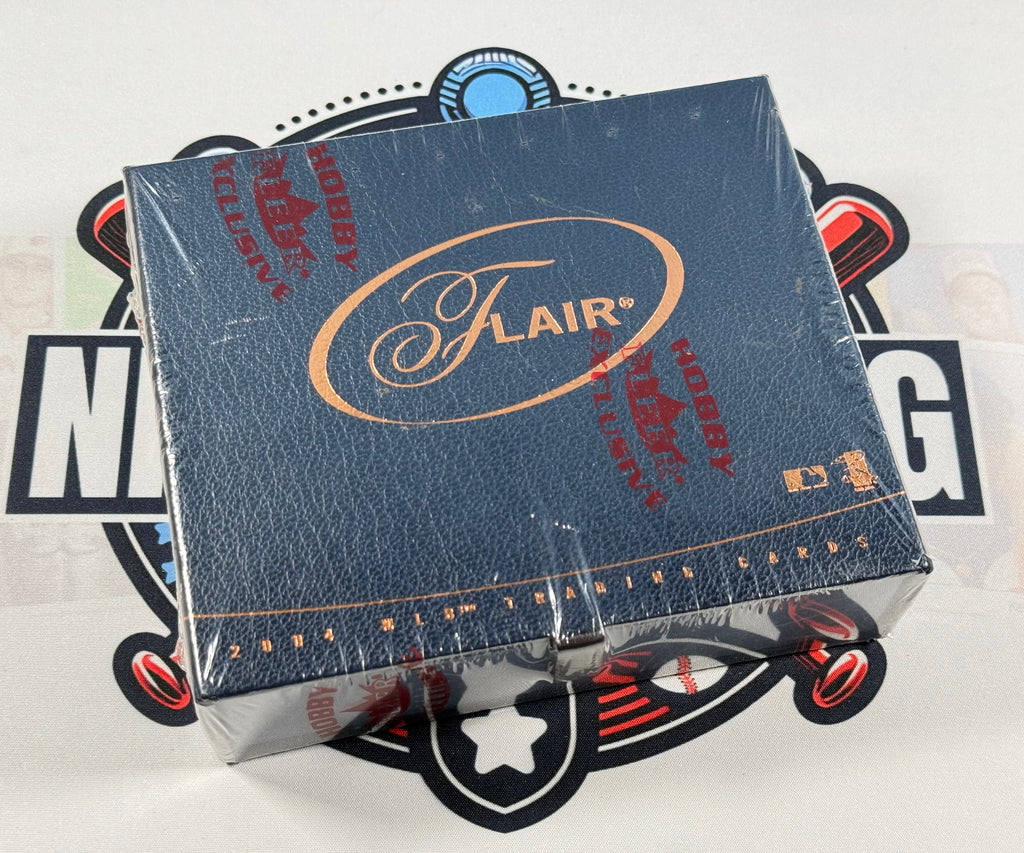 A sealed blue Flair Hobby Box card deck package wrapped in clear plastic, photographed from above on a white surface with a black-and-white graphic background.