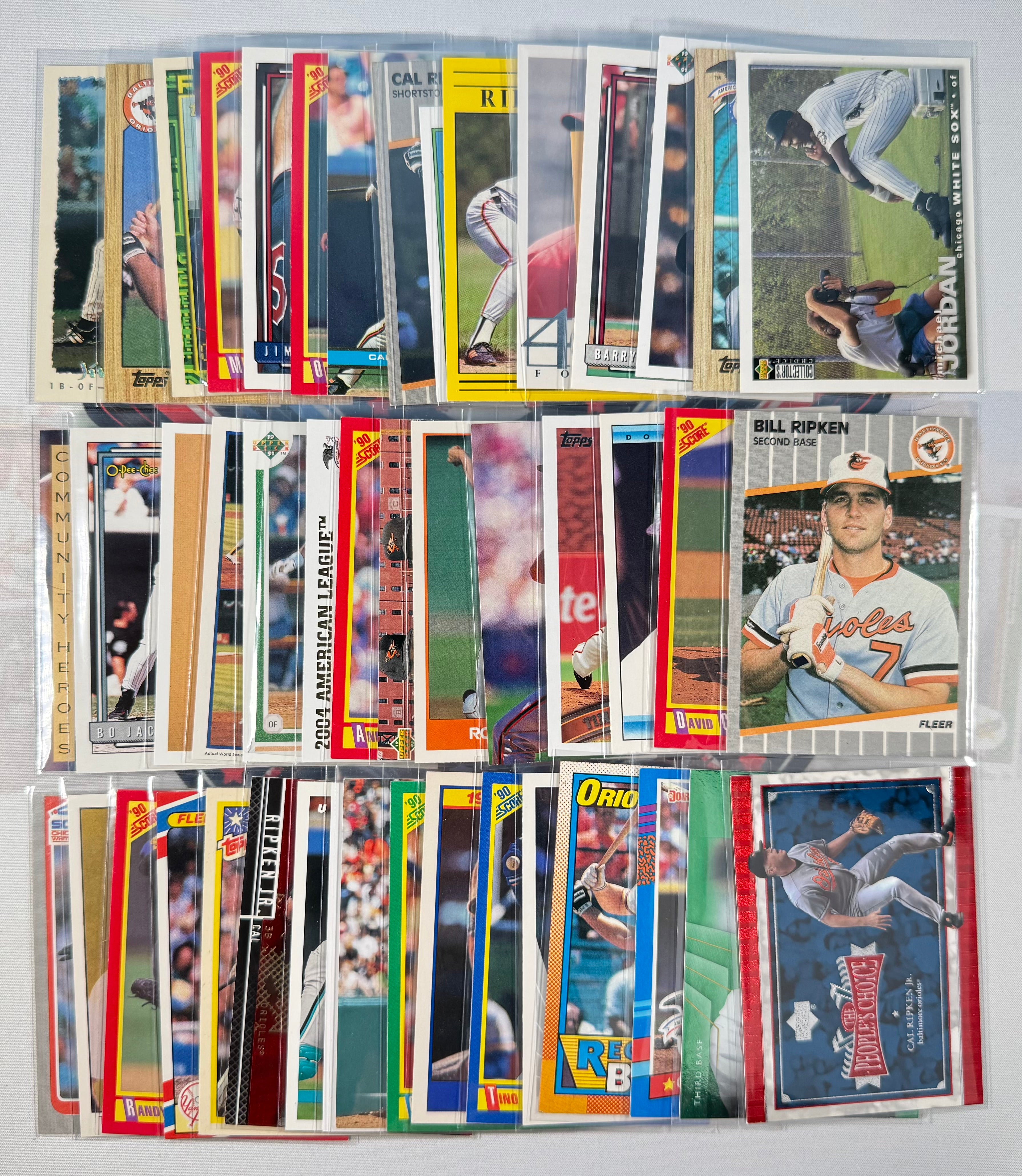 Collection of baseball trading cards displayed on a white background