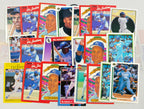 Collection of baseball trading cards featuring various players on a white background