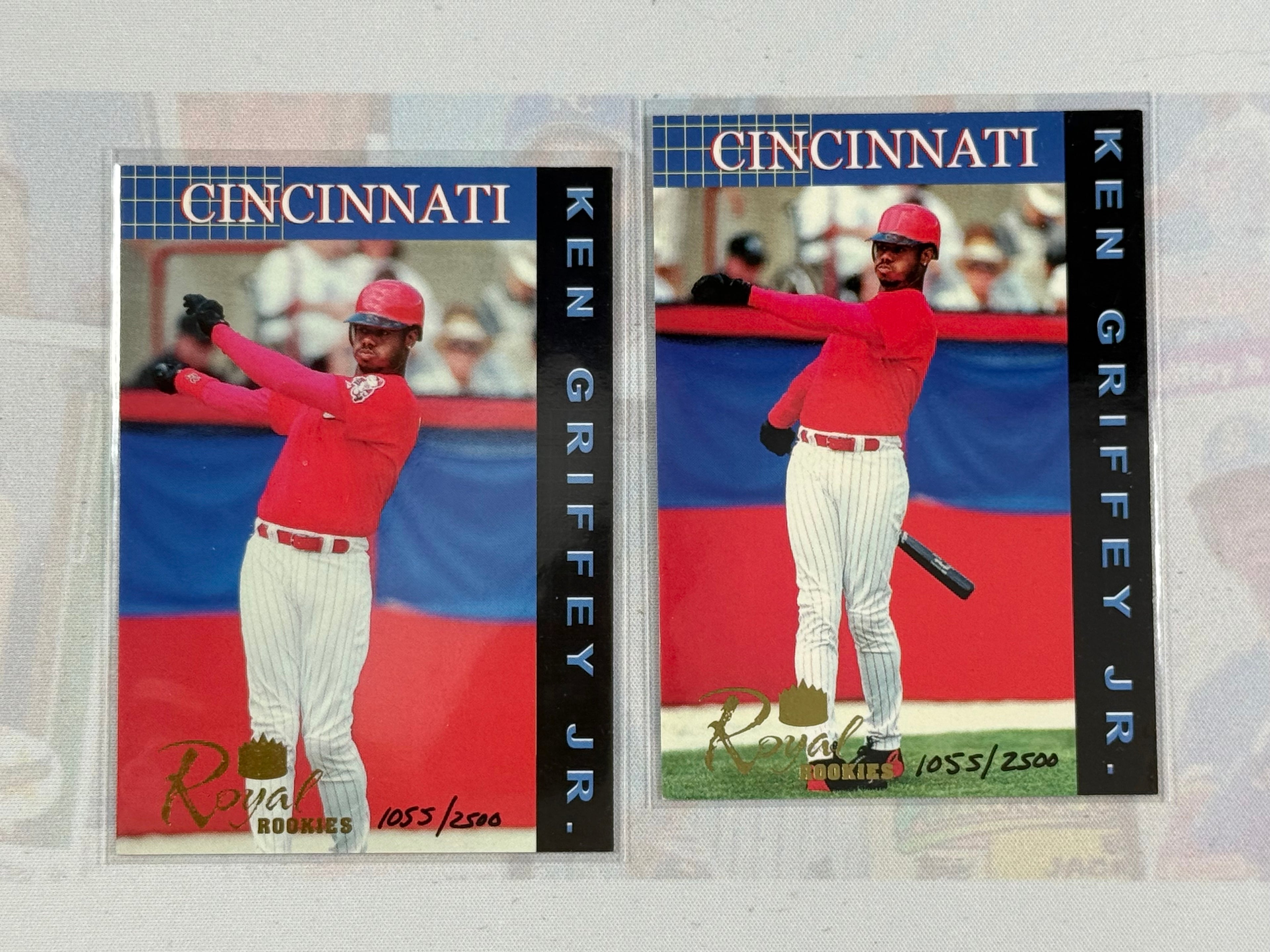 Two baseball trading cards of Ken Griffey Jr. with Cincinnati on a textured background.