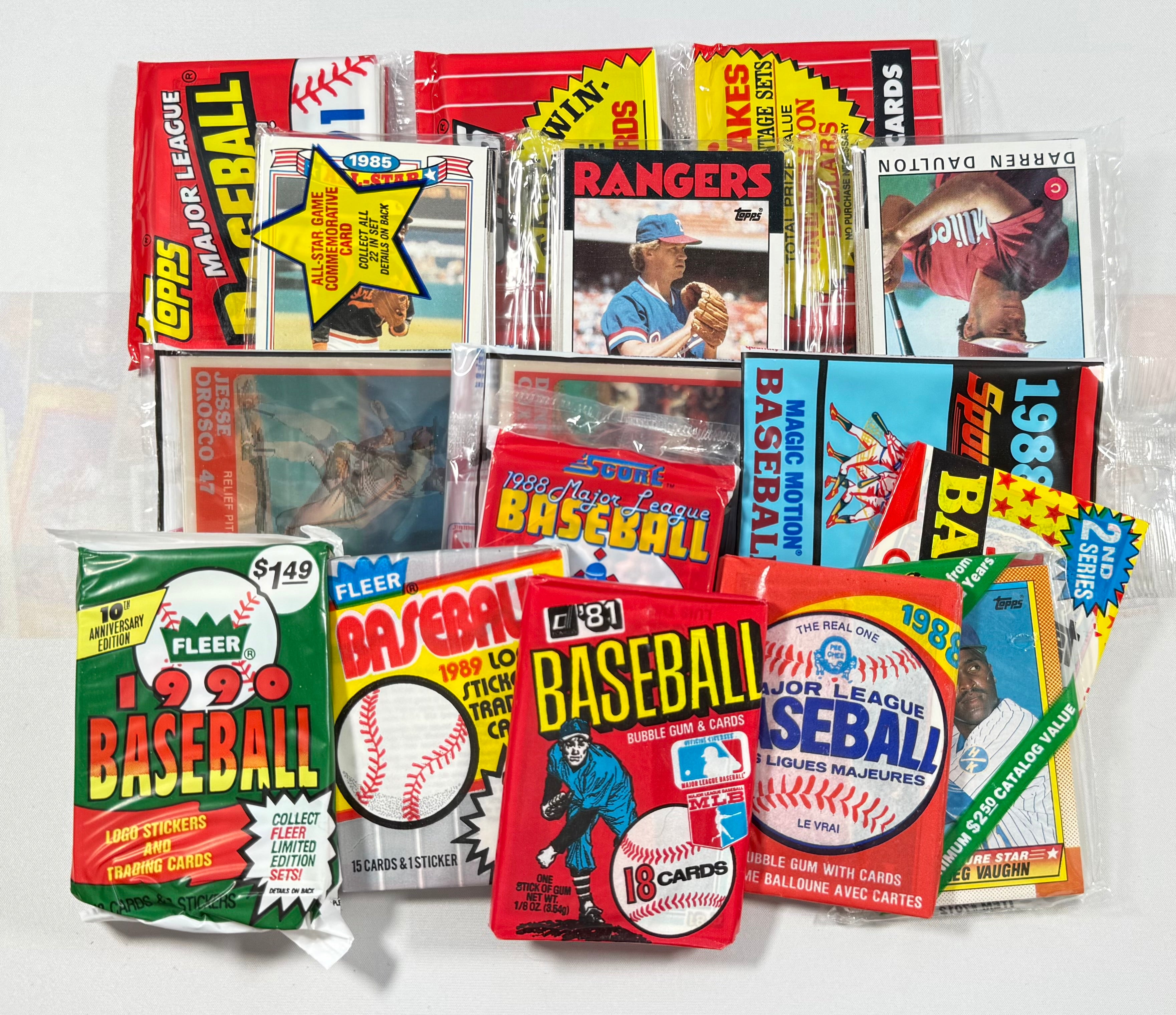 Collection of vintage baseball trading card packs on a white background