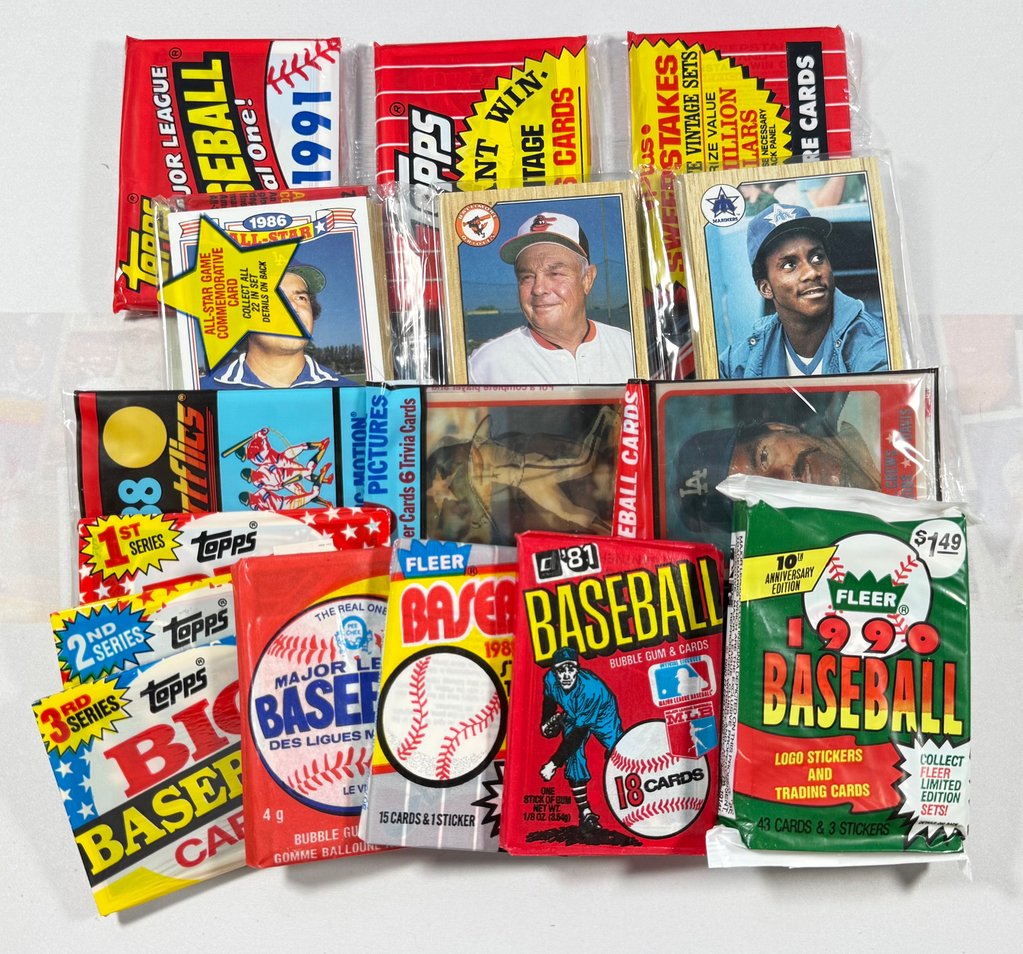 Collection of vintage baseball trading card packs on a white background