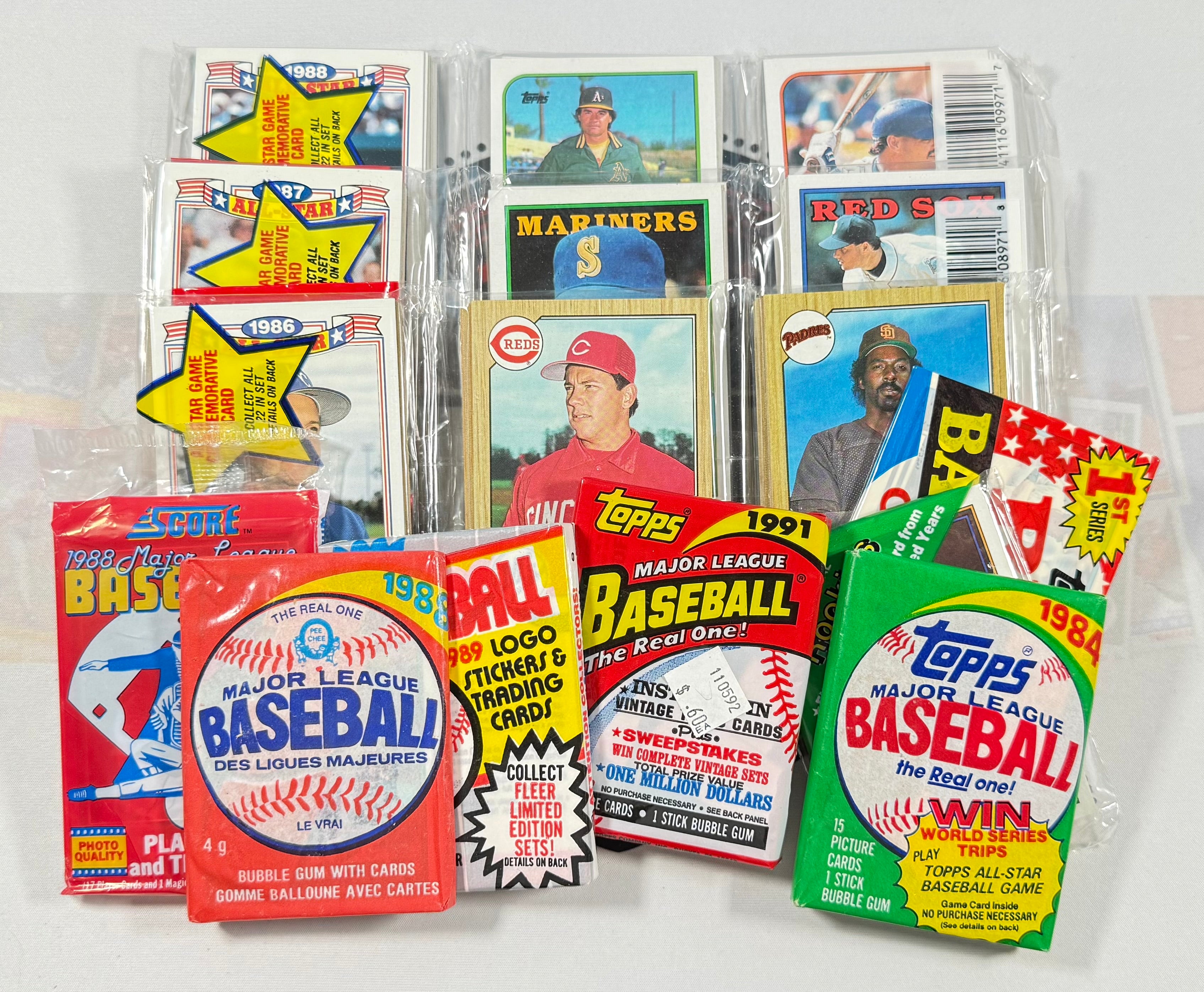 Collection of vintage Topps baseball trading cards in packaging on a white background