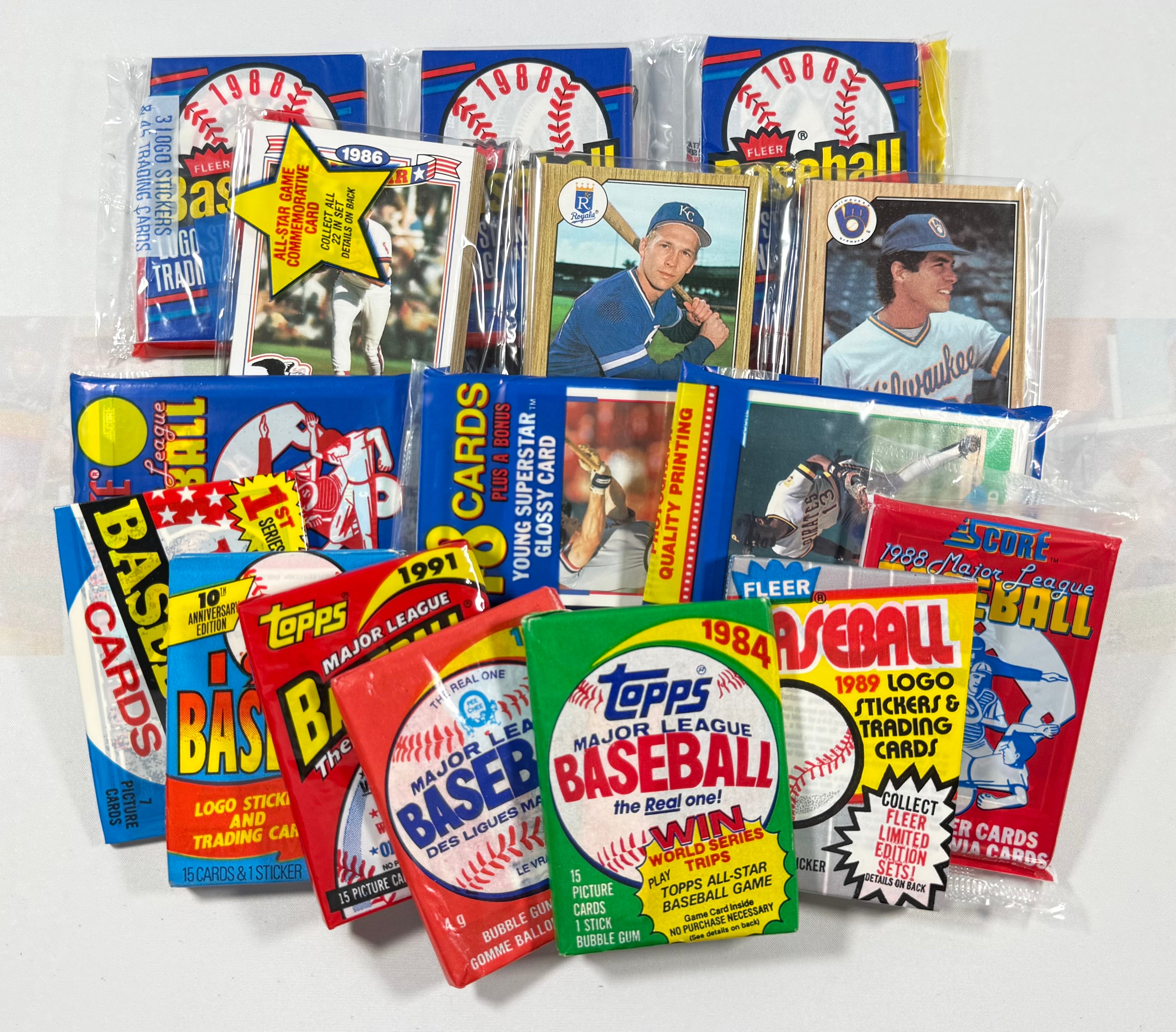 Collection of vintage baseball trading card packs and boxes on a white background